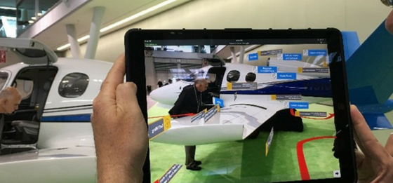 Augmented reality: Data and inspection path overlaid on camera image of airplane